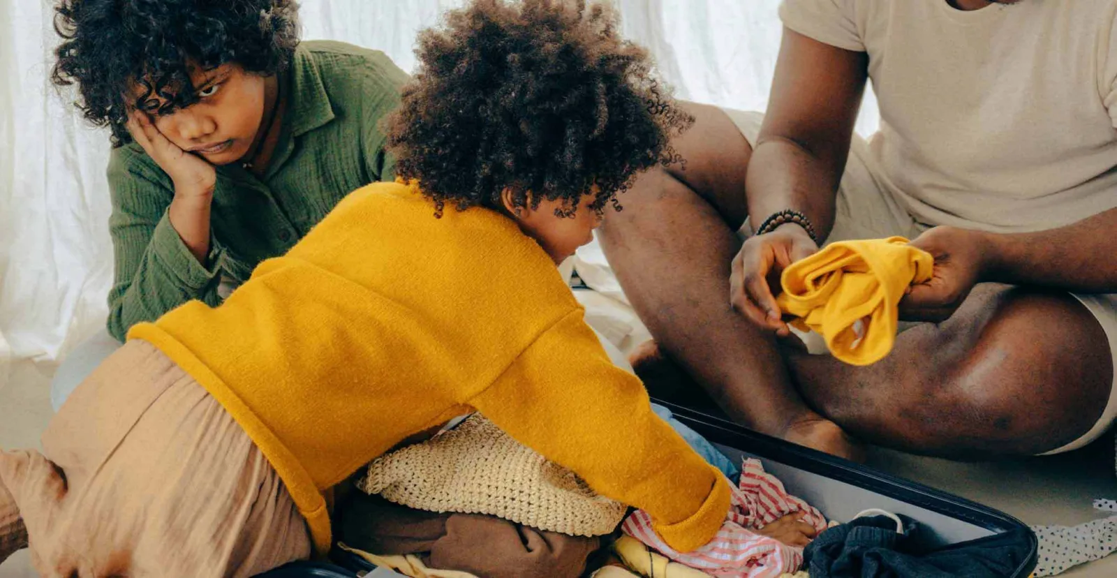 Family packing suitcase
